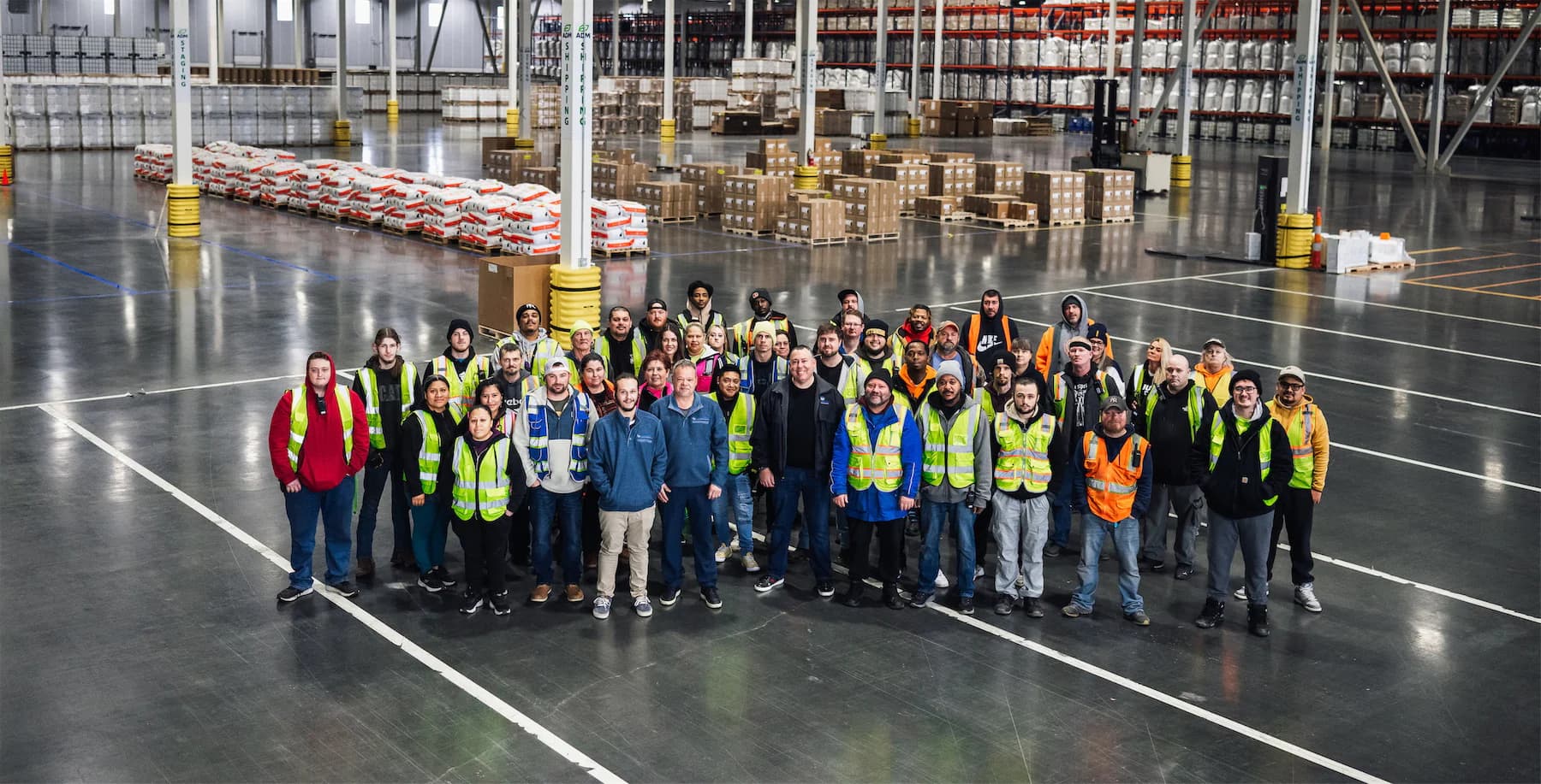 Commonwealth team gathered in the warehouse