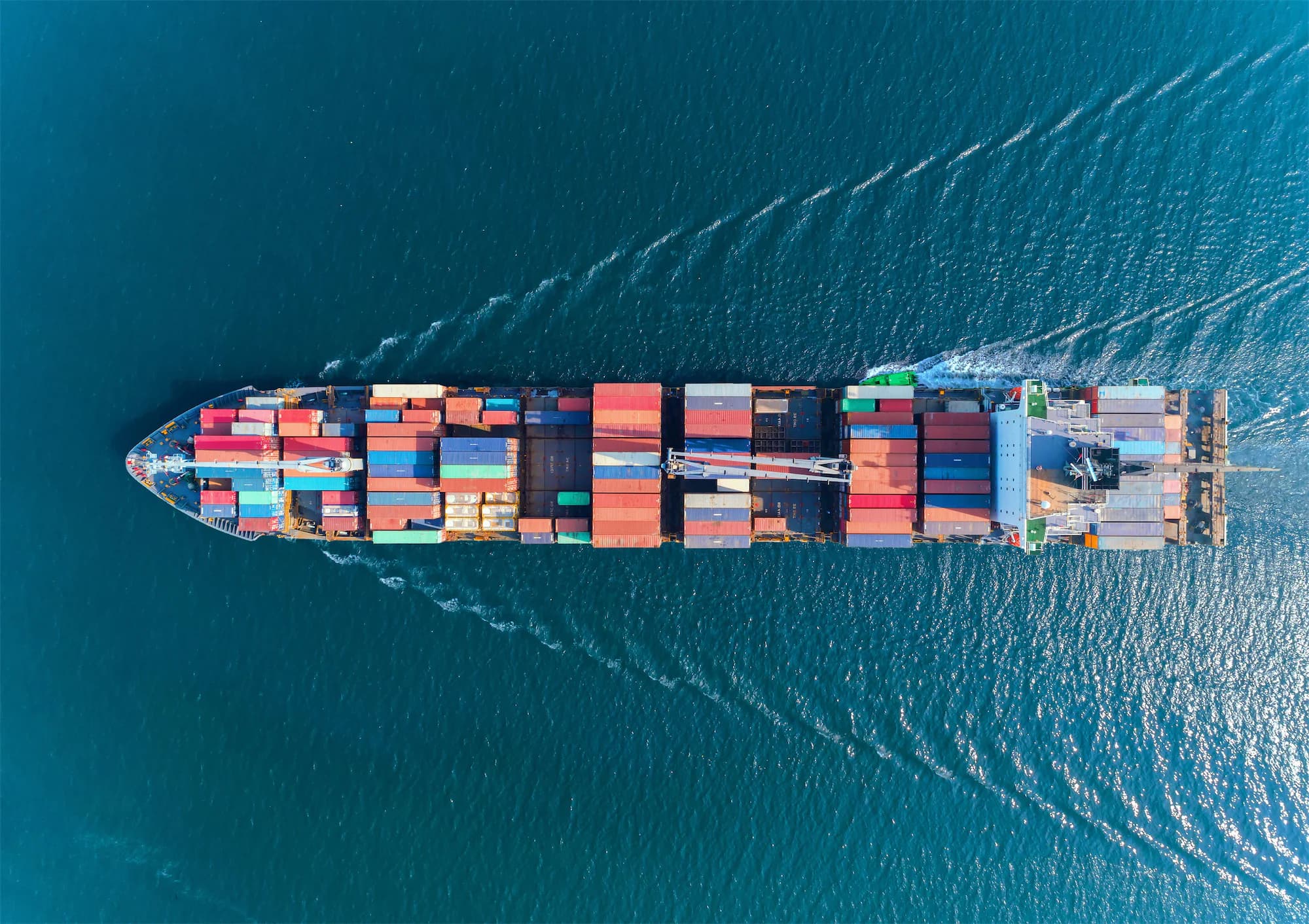 Container ship carrying intermodal cargo at sea
