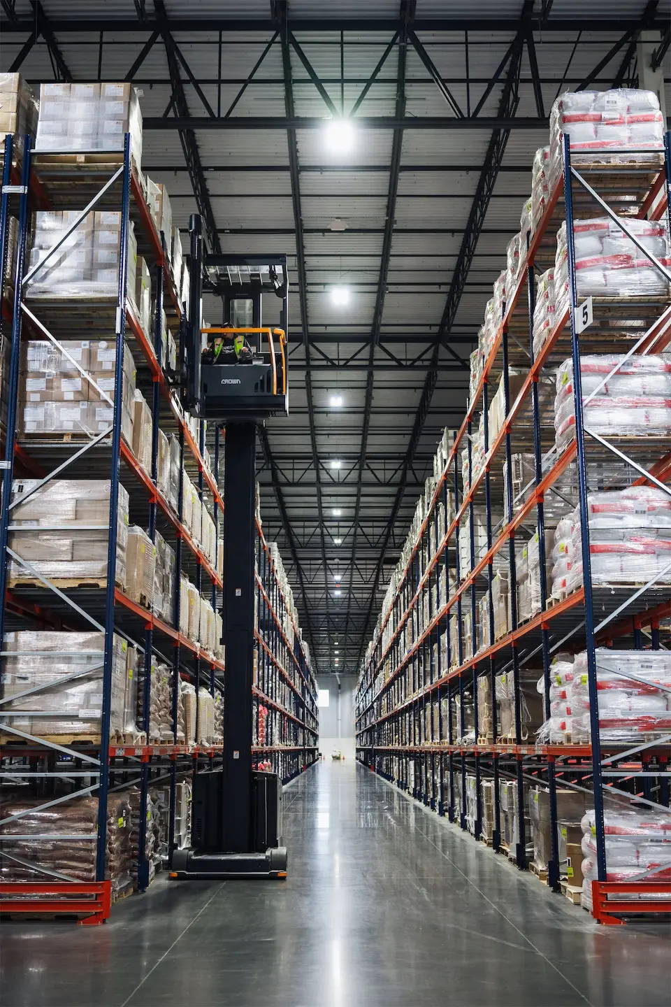 Lift extended to top shelf of pallet rack